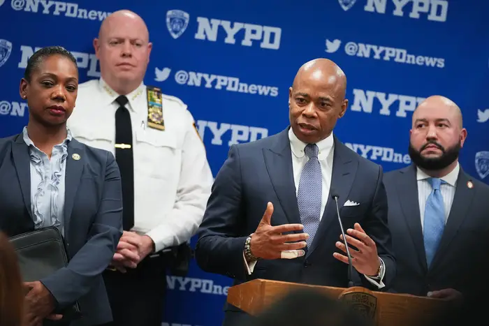 Mayor Eric Adams at the podium during a press briefing reporters on the NYPD's Neighborhood Safety Teams in March.